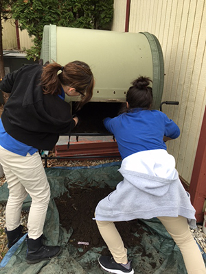 Students working with the composter in Food and Agriculture Class